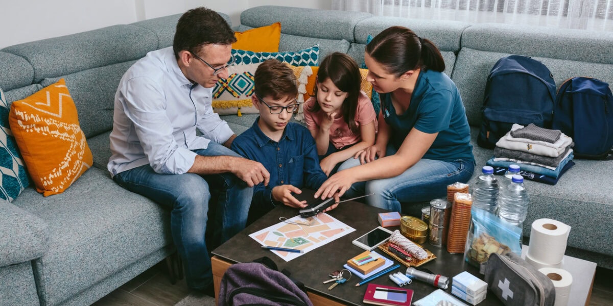 a family packing for an overseas vacation, having purchased natural disaster insurance for their trip