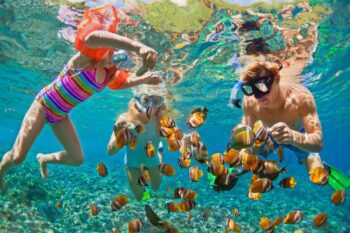 family-vacation-snorkeling a family snorkeling in Costa Rica, one of the best family vacation ideas in 2025