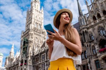 tourist-in-munich a young girl standing in front of Munich Cathedral, having obtained an ETIAS for European travel