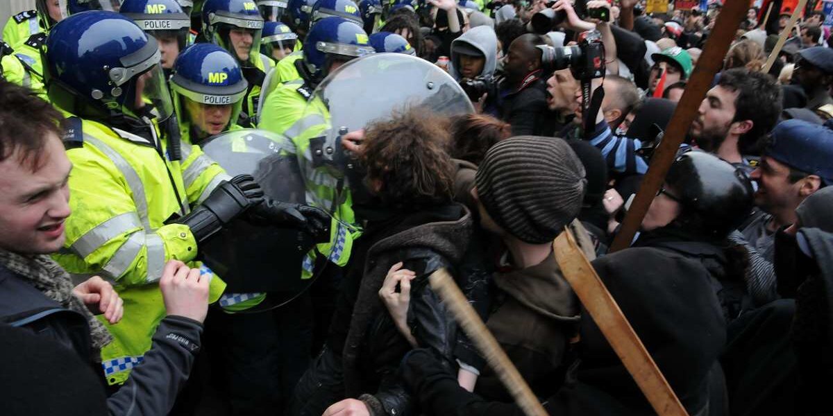 austerity-rally-london Protesters and police clash at an austerity rally in London, indicating the need to buy UK travel insurance for travel disruptions