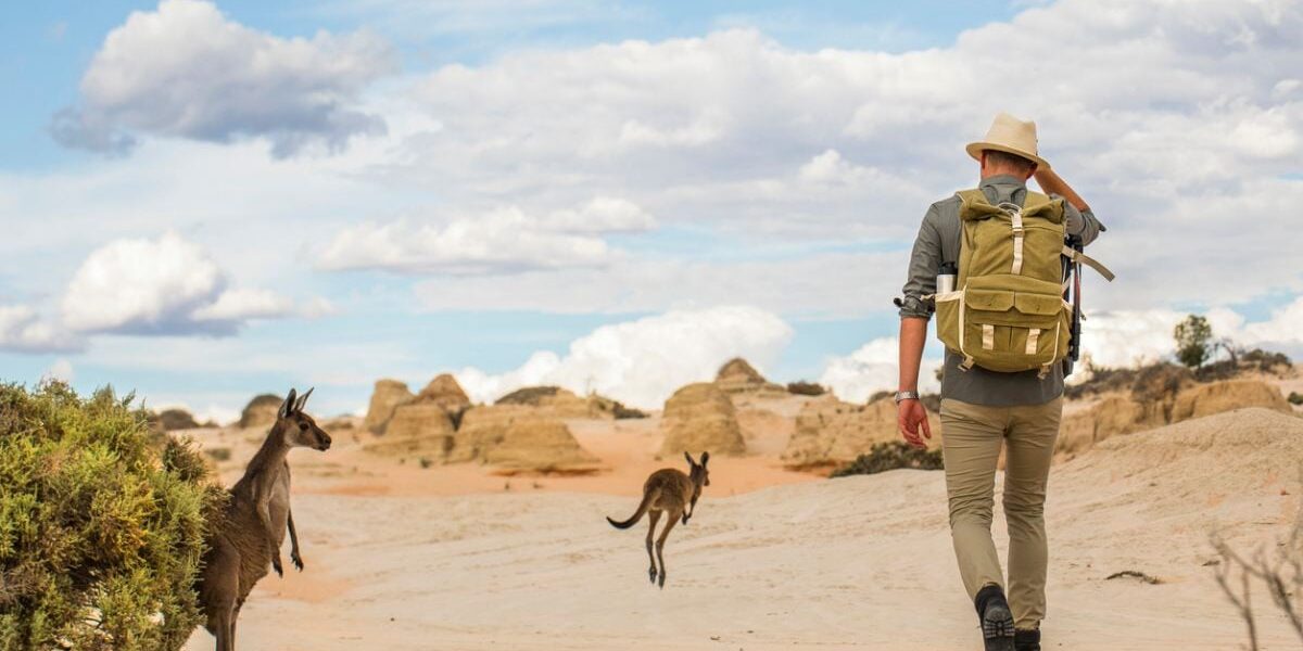 outback-hiking-australia a man hiking in the Australian outback, having secured travel insurance for Australia before taking his trip