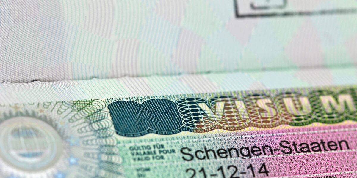 schengen-visa-application a close-up of a Schengen visa, which requires specific Schengen visa insurance