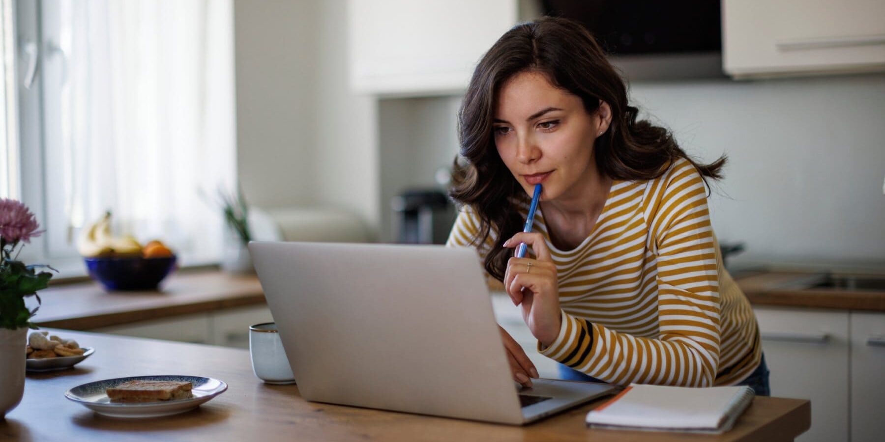 woman-researching-on-laptop a woman reading tips for finding a doctor abroad